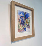 Maleriet "Solgløtt" er rammet inn med eik og kunstglass. 