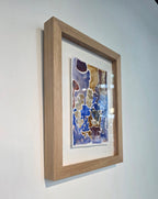 Maleriet "Villblomst" leveres med en ramme i eik og med kunstglass. 